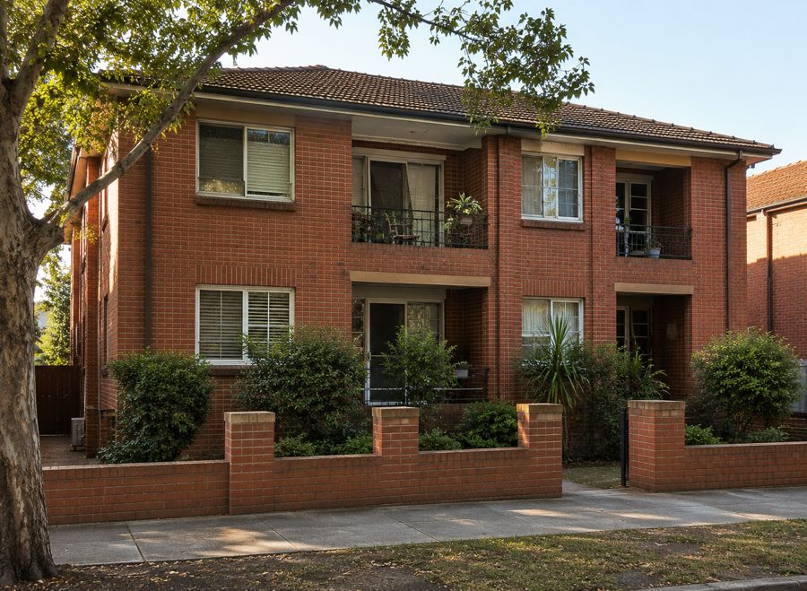 A two storey red brick unit block