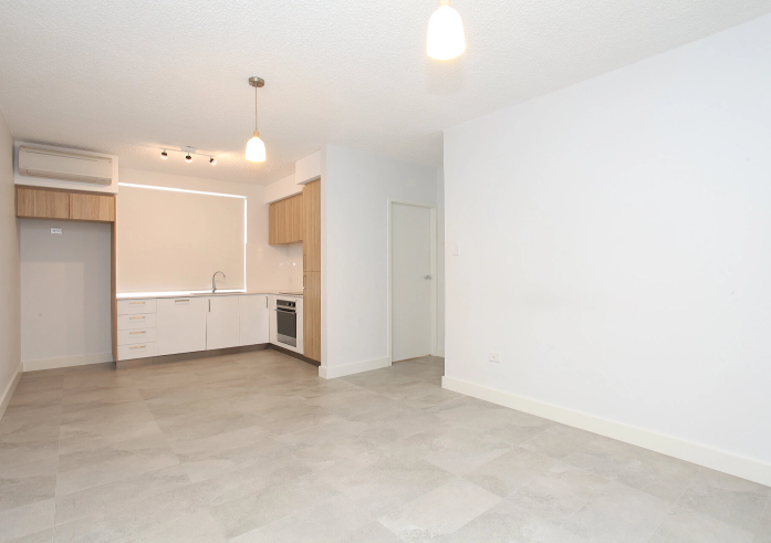 A vacant lounge and dining room before virtual furniture